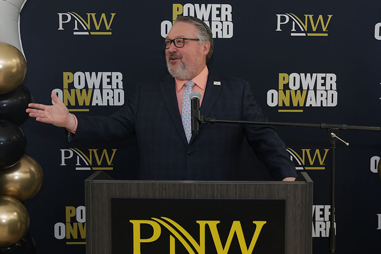 PNW Chancellor Chris Holford gives his formal remarks during the Excellence Evolving leadership celebration in Westville.