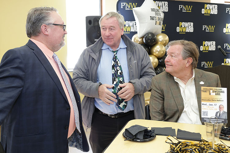 From left, PNW Chancellor Chris Holford meets with David Feikes, professor of Mathematics, and Don Babcock, director of Economic Development, at the Excellence Evolving leadership celebration in Westville.