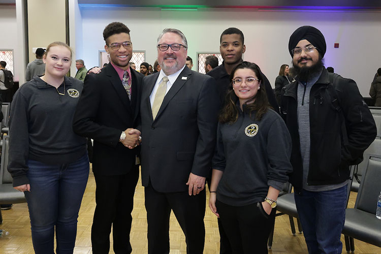2023-24 PNW Student Government Association members pose for a photo with PNW Chancellor Chris Holford during the Excellence Evolving leadership celebration.