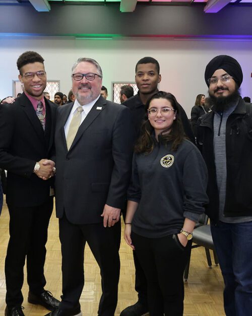 2023-24 PNW Student Government Association members pose for a photo with PNW Chancellor Chris Holford during the Excellence Evolving leadership celebration.
