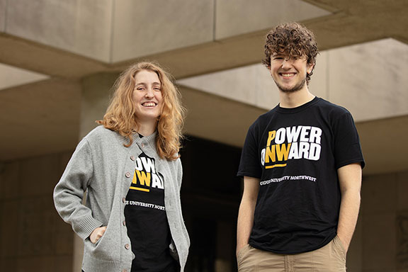 Two PNW students stand side by side in Power Onward t-shirts