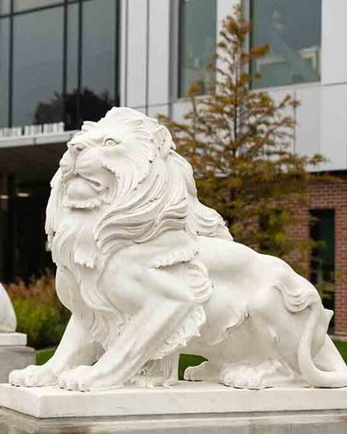 Statues of lions in front of Purdue University Northwest's NILS building.