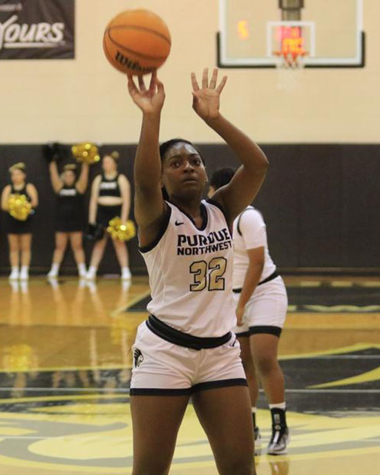 Player from PNW's women basketball team shoots the ball.