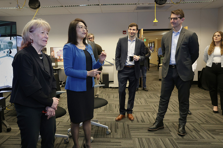 Chenn Zhou, center, NIPSCO Distinguished Professor of Engineering Simulation and founding director of CIVS, helps with guiding a tour of CIVS’ visualization lab with U.S. Department of Energy and congressional officials.