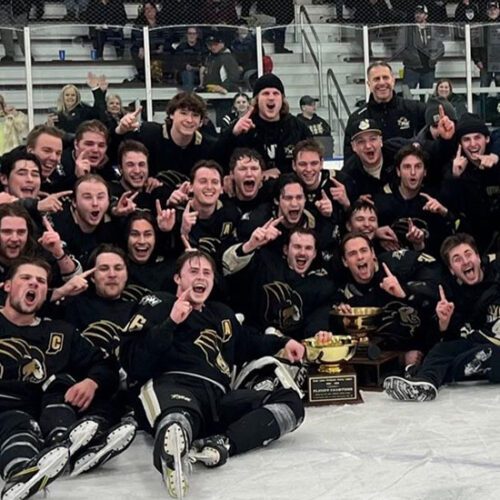 The PNW D1 Hockey team posts with the GLCHL Championship trophy