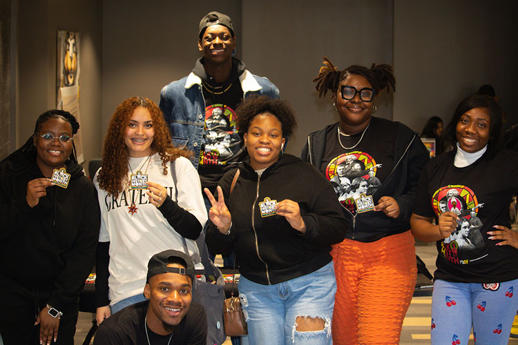 Five students pose together during the Black History Month Launch Party