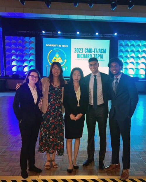 Five people stand together. From left ot right: Alyssa Gargano, Jay Chen, Grace Yang, Julian Silva, and Quin Owens.