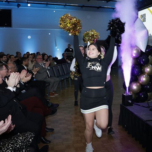 PNW cheerleaders march in at Founders Day 2024