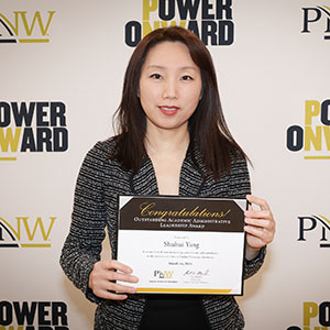 Professor Shuhui Yang poses with her Founders Day 2024 award.