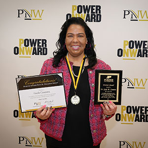 Gisele Casanova holds her Martin Luther King Jr. Dreamer Award recognitions at Founders Day 2024.