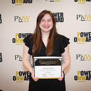 McKenzie Dinga holds her Founders Day 2024 award.