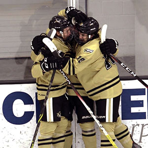 PNW hockey players celebrate their win in the 2024 ACHA DI Tournament