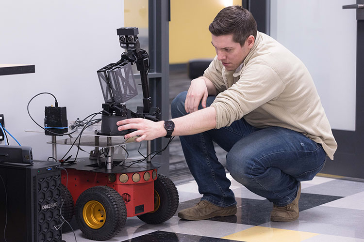 A student works on a robot