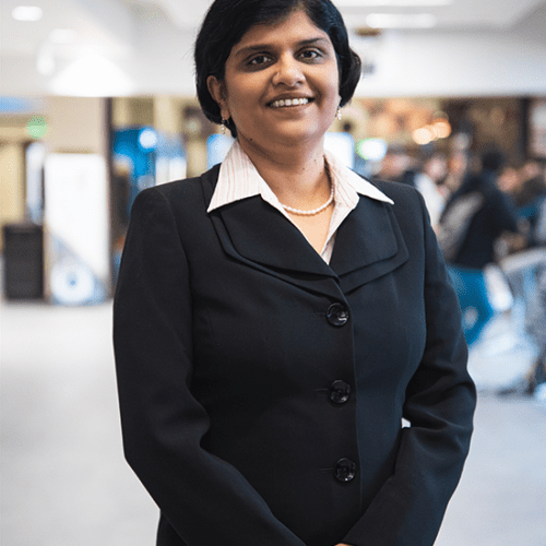 Shreya Bhandari stands in a hallway