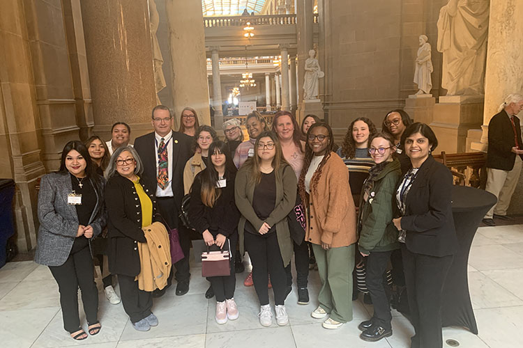 Students stand with Senator David Vinzant from District 3 during LEAD Day.
