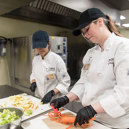 PNW Kitchen at the Hospital and Management Building with two students working