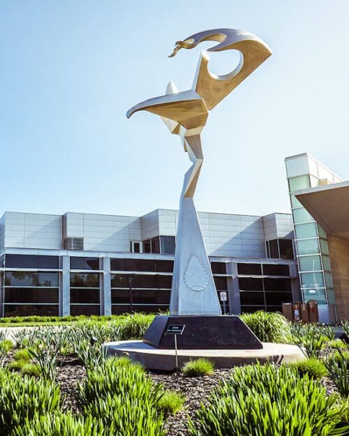 A silver statue outside of the PNW Dworkin Center