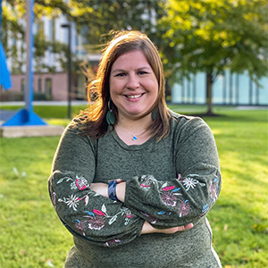 PNW admissions counselor Amy Hackstedt stands outdoors.