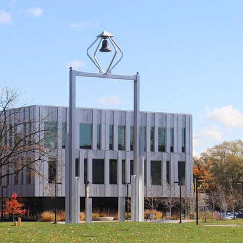 A view of the PNW Bell Tower with the Nils K. Nelson Bioscience Innovation Building behind it.