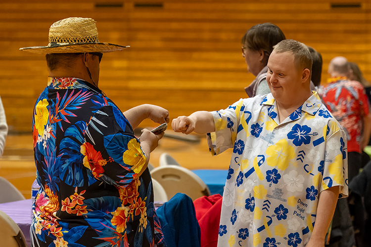 Leo's Spring Fling dance 2025 photo, two people doing a fist bump