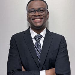 PNW graduate Terrell Sucre in suit and tie