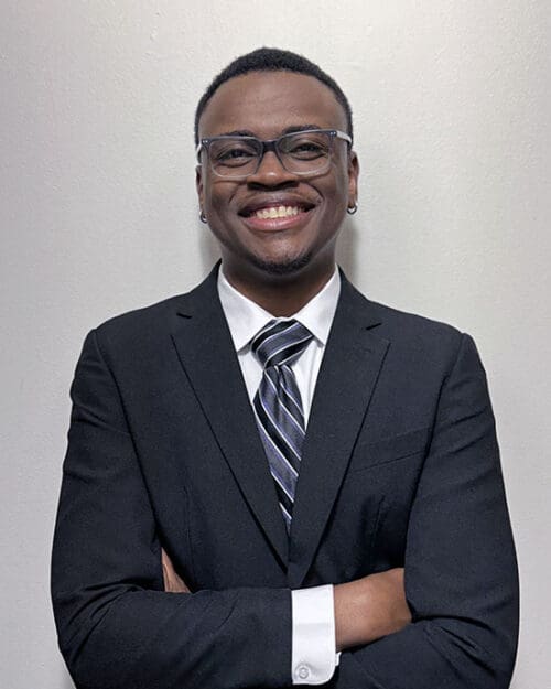 PNW graduate Terrell Sucre in suit and tie