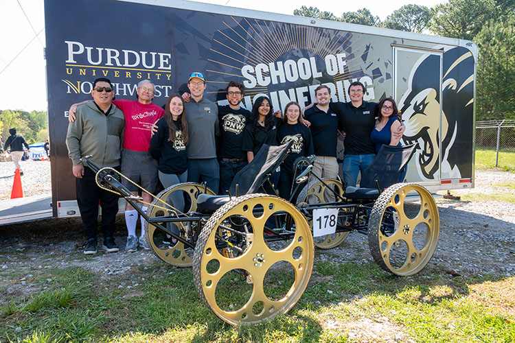 Students gather with their NASA Rover outside of the School of Engineering trailer.