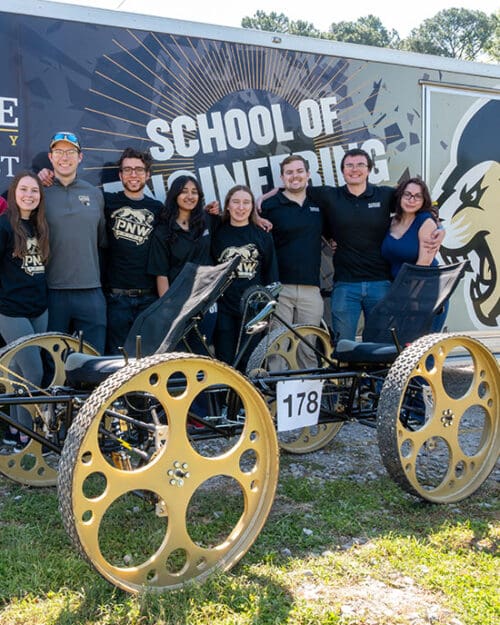 Students gather with their NASA Rover outside of the School of Engineering trailer.
