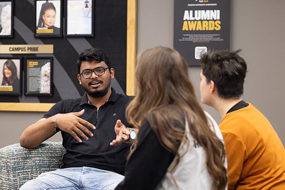 Students talk in a campus longe