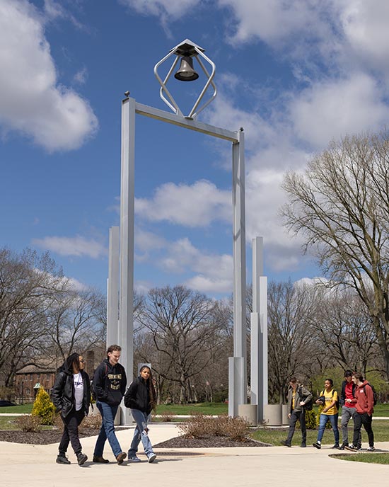 Students walk by the Bell Tower on Purdue University Northwest's Hammond campus