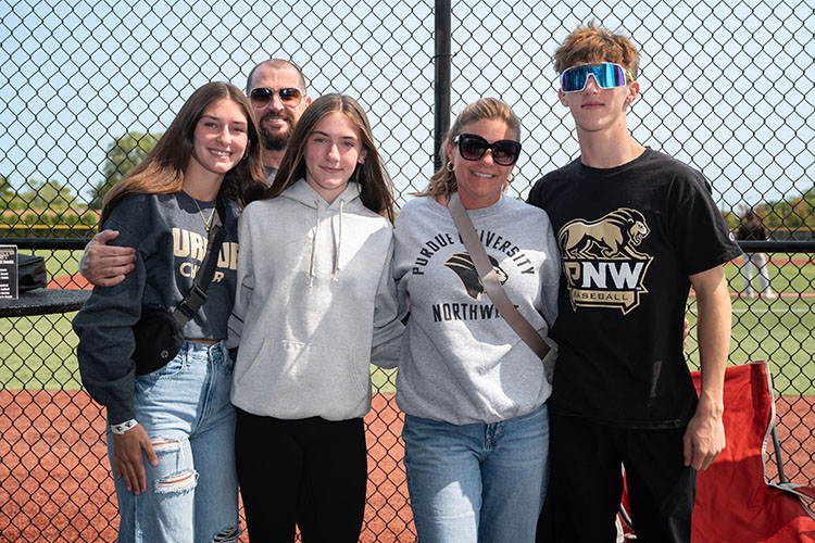 A family of five stands together at PNW sports fest