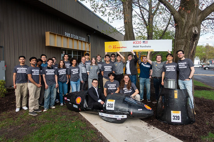 The PNW Shell Eco-marathon team poses with their vehicle.