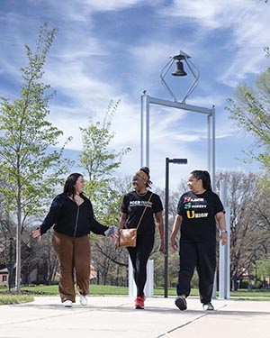 Students walk in front of the PNW Bell Tower