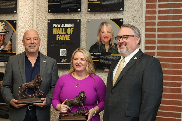 Mitchell “Mason” Macenski, Nicole Kupchik, and PNW Chancellor Kenneth C. Holford pose together
