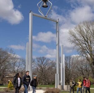 Students walk by the Bell Tower on Purdue University Northwest's Hammond campus
