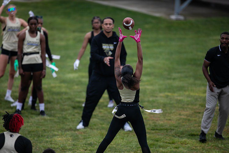 PNW's flag football team member makes a catch