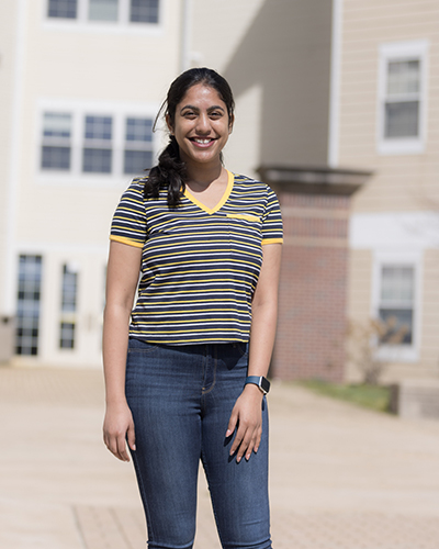 Rushitha Manchireddy testimonial photo - in front of dorm building