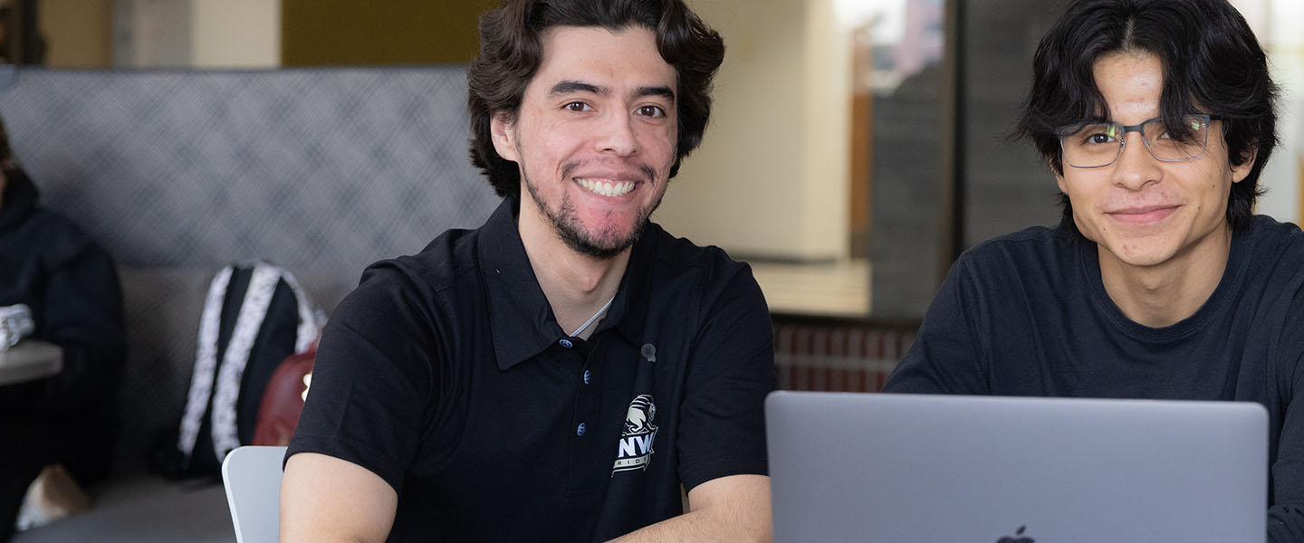 PNW students collaborate over a computer