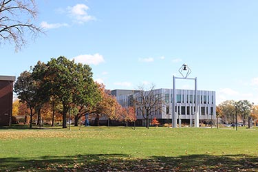 A fall view of the PNW Bell Tower and Nils K Nelson Bioscience Innovation Building.