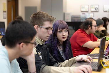 PNW cybersecurity students collaborate in the classroom.