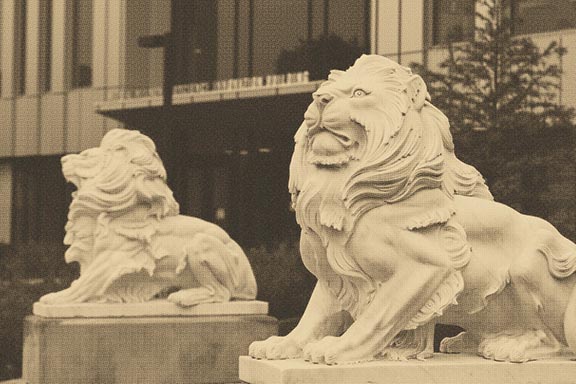 Photo of two Lion Sculptures with a Gold Overlay