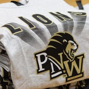 Closeup of a PNW Lions t-shirt folded on a table