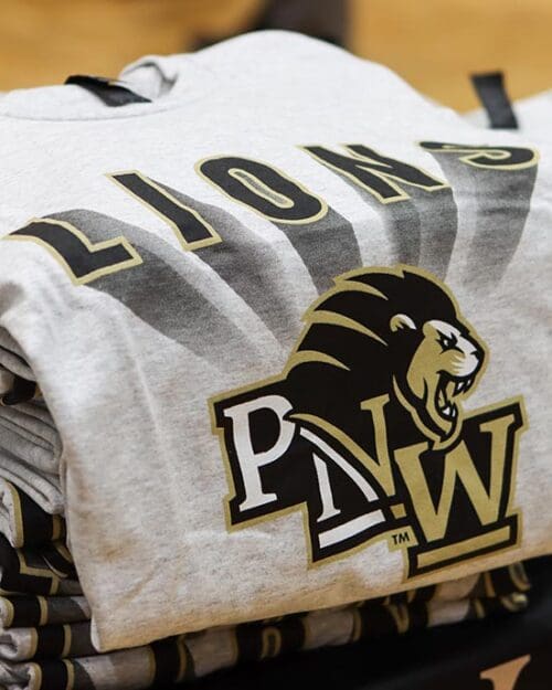 Closeup of a PNW Lions t-shirt folded on a table