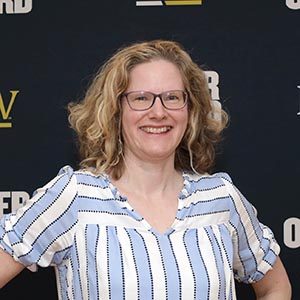 Grethe Hystad before a PNW/Power Onward banner.