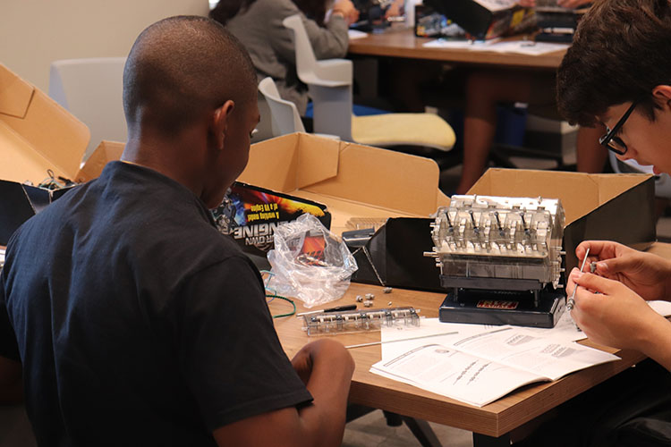 Students at a summer camp work on an engineering project. 