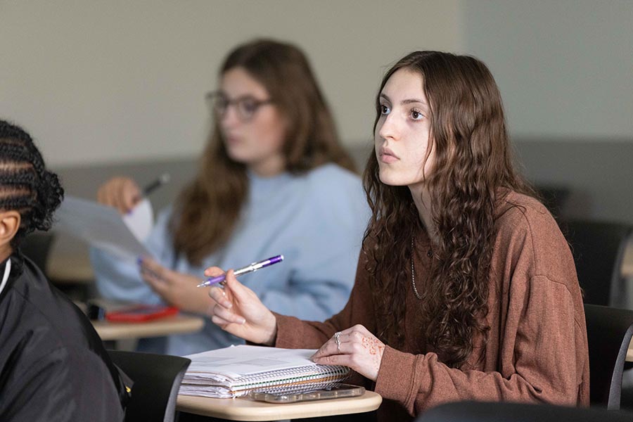PNW Students taking notes while listening to the professor lecture