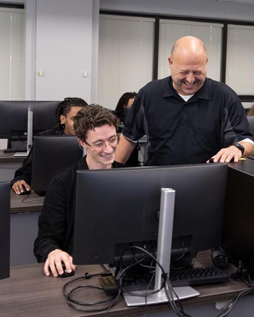 An instructor leads a computer-lab demonstration.