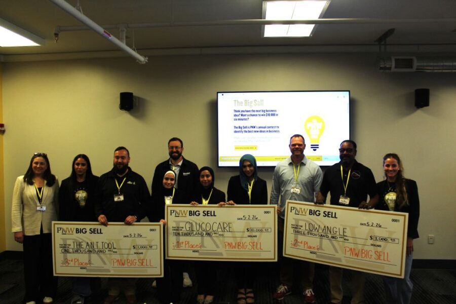 The PNW Big Sell 2026 winners holding giant checks. First place – Glucocare, Second place – Low Angle, Third place – The ANT Tool