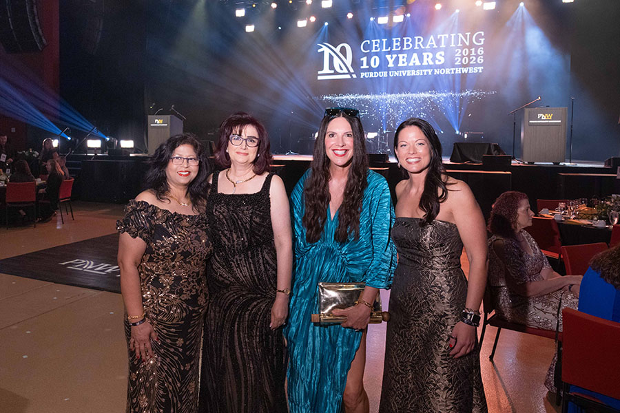 Neeti Parashar, Raida Abuizam, Julie Wiejak, and Liz Depew pose together.