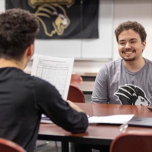 PNW students talk in the classroom